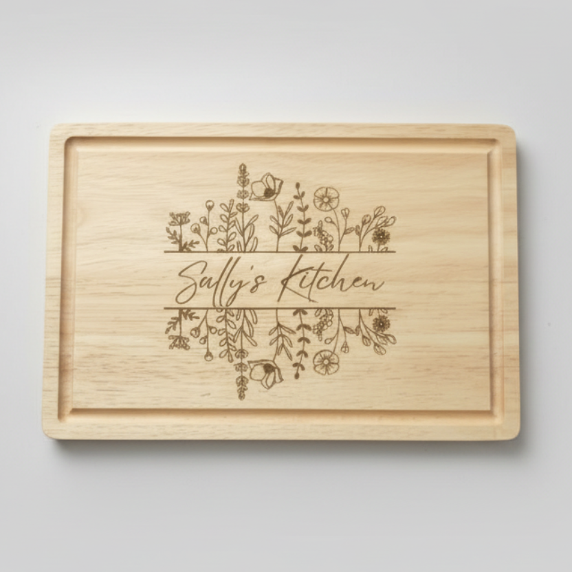 Wooden cutting board with 'Sally's Kitchen' engraving on a light surface